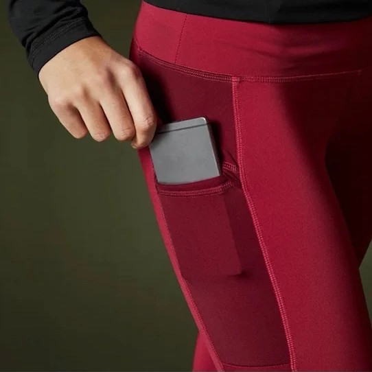 خرید لگ ورزشی زنانه/برند راک تریل/رنگ زرشکی/جنس پلی استر و الاستان/ضد تعریق و تنفس پذیر نمای جیب