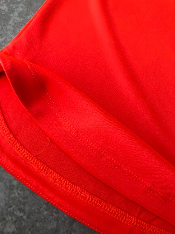 خرید تاپ زنانه ورزشی کریویت نارنجی پلی استر و الاستان نمای پارچه | صبامی